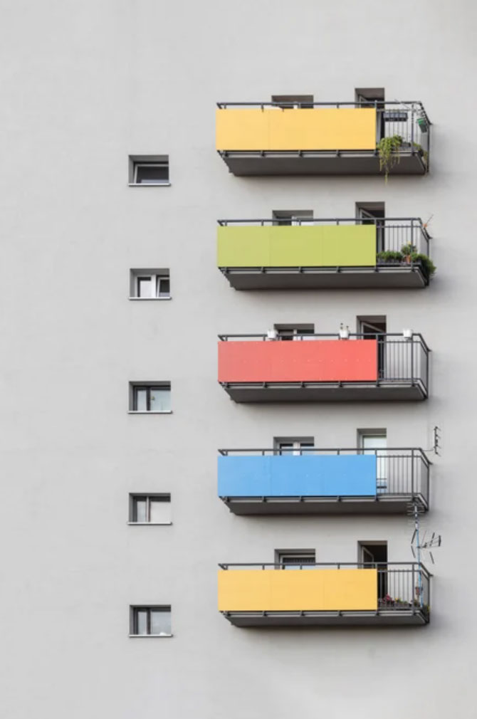 Outside of hoursing building with colourful balconies